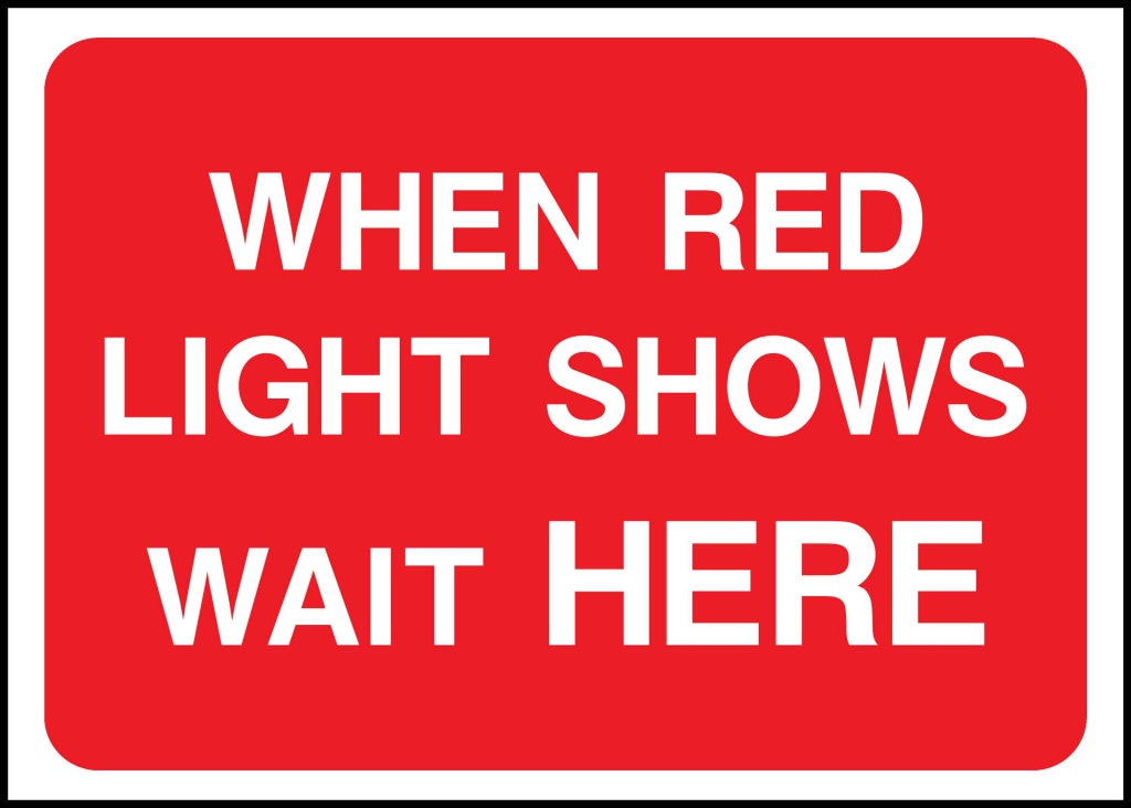 WHEN RED LIGHT SHOWS 
WAIT HERE - Safety Decals Ltd